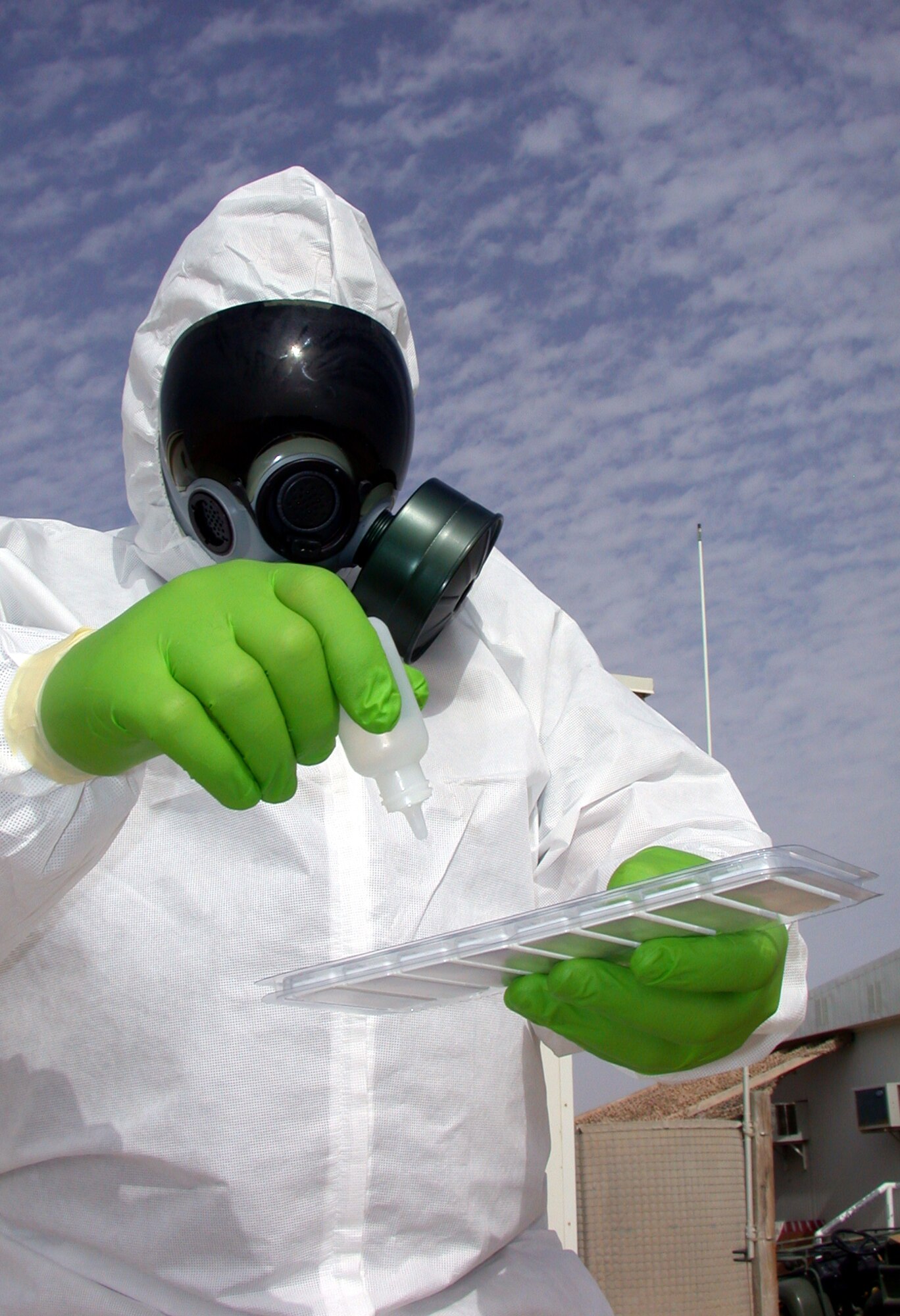 SOUTHWEST ASIA -- Tech. Sgt. Ivan Candelario holds a biological agent testing kit.  He is the noncommissioned officer in charge of the 380th Expeditionary Readiness Flight's logistics section.  The readiness flight is responsible for managing the Full Spectrum Threat Response program for the 380th Air Expeditionary Wing.  This program is the successor to the Cold War-era disaster preparedness program.  (U.S. Air Force photo by Master Sgt. Michael A. Ward)