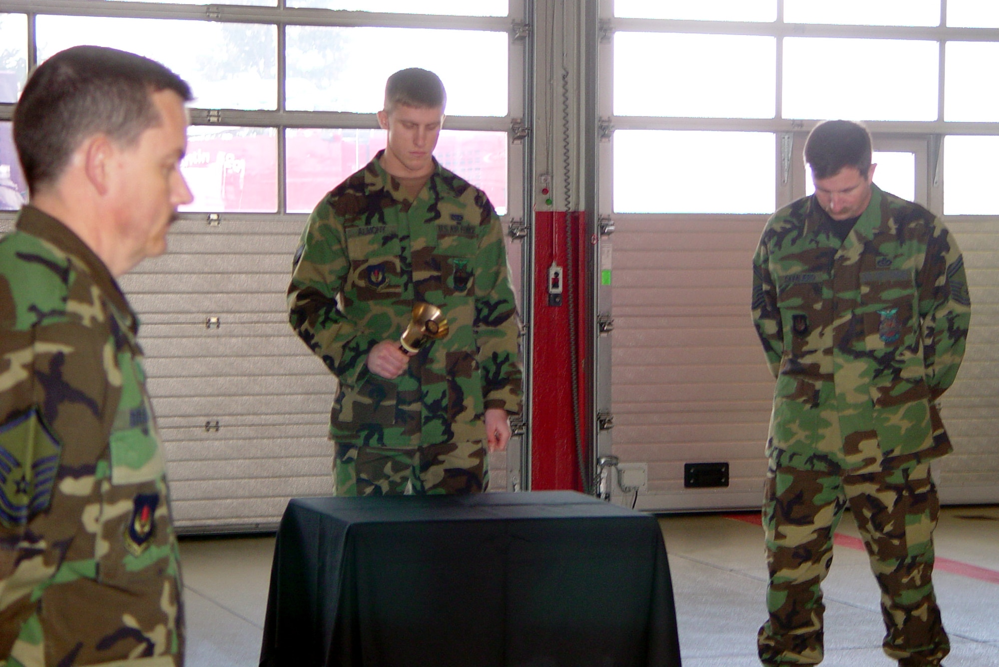 SPANGDAHLEM AIR BASE, Germany -- Firefighters here ring a bell during a one-minute "final alarm" ceremony Feb. 16 honoring Staff Sgt. Ray Rangel who died while attempting to rescue two Soldiers after their Humvee overturned in a canal in Iraq.  (Courtesy photo)