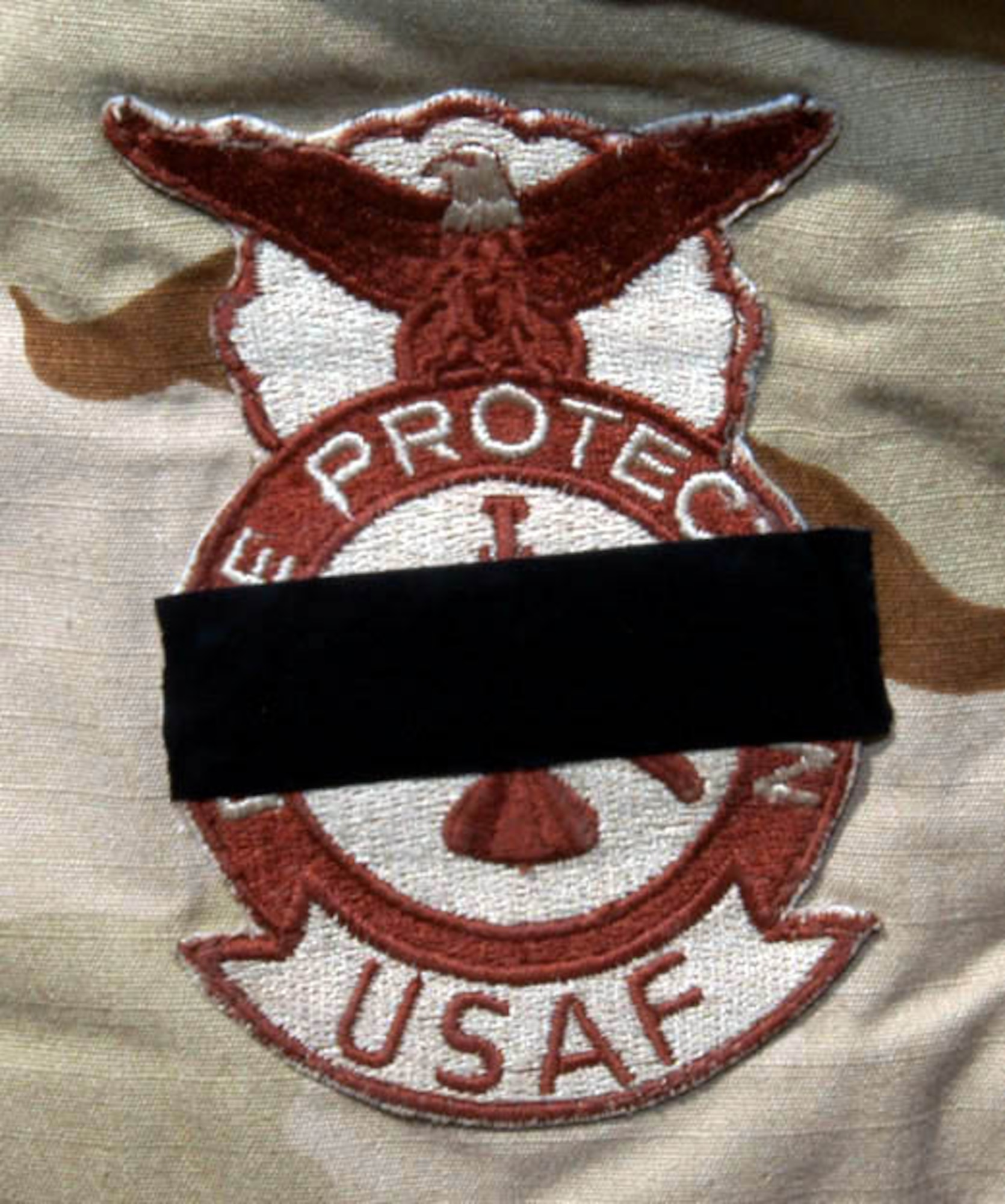 SOUTHWEST ASIA -- Air Force firefighters worldwide wore black tape on their badges Feb. 16 to honor Staff Sgt. Ray Rangel who died while attempting to rescue two Soldiers after their Humvee overturned in a canal in Iraq.  (Courtesy photo)