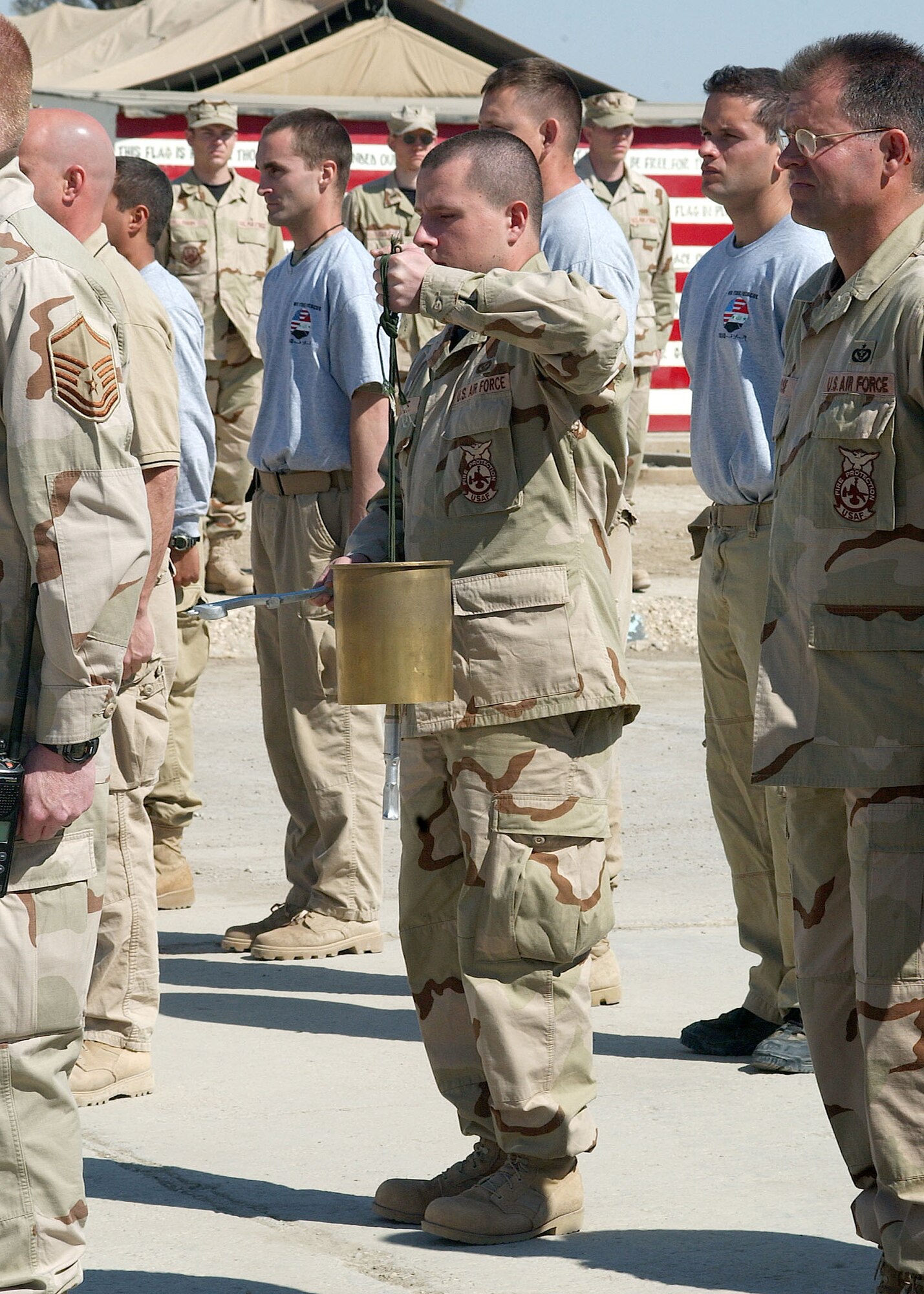 TALLIL AIR BASE, Iraq -- Firefighters here hold a one-minute "final alarm" ceremony Feb. 16 honoring Staff Sgt. Ray Rangel who died while attempting to rescue two Soldiers after their Humvee overturned in a canal in Iraq.  (Courtesy photo)