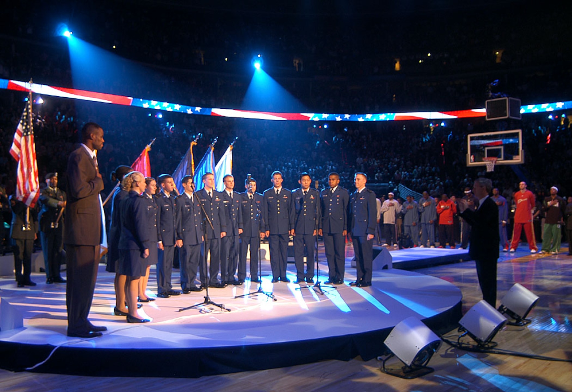 DENVER -- The U.S. Air Force Academy Cadet Chorale and David Robinson, a retired San Antonio Spur and a 1987 Naval Academy graduate, sing the national anthem at the 2005 NBA All-Star Game here Feb. 20. The cadet chorale's visit was part of the NBA's salute to the men and women of the armed forces. (U.S. Air Force photo by Staff Sgt. Steve Grever)