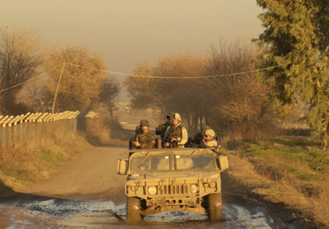 U.S. Special Forces and Albanian soldiers conduct a joint patrol in Iraq on Jan. 13, 2005. 