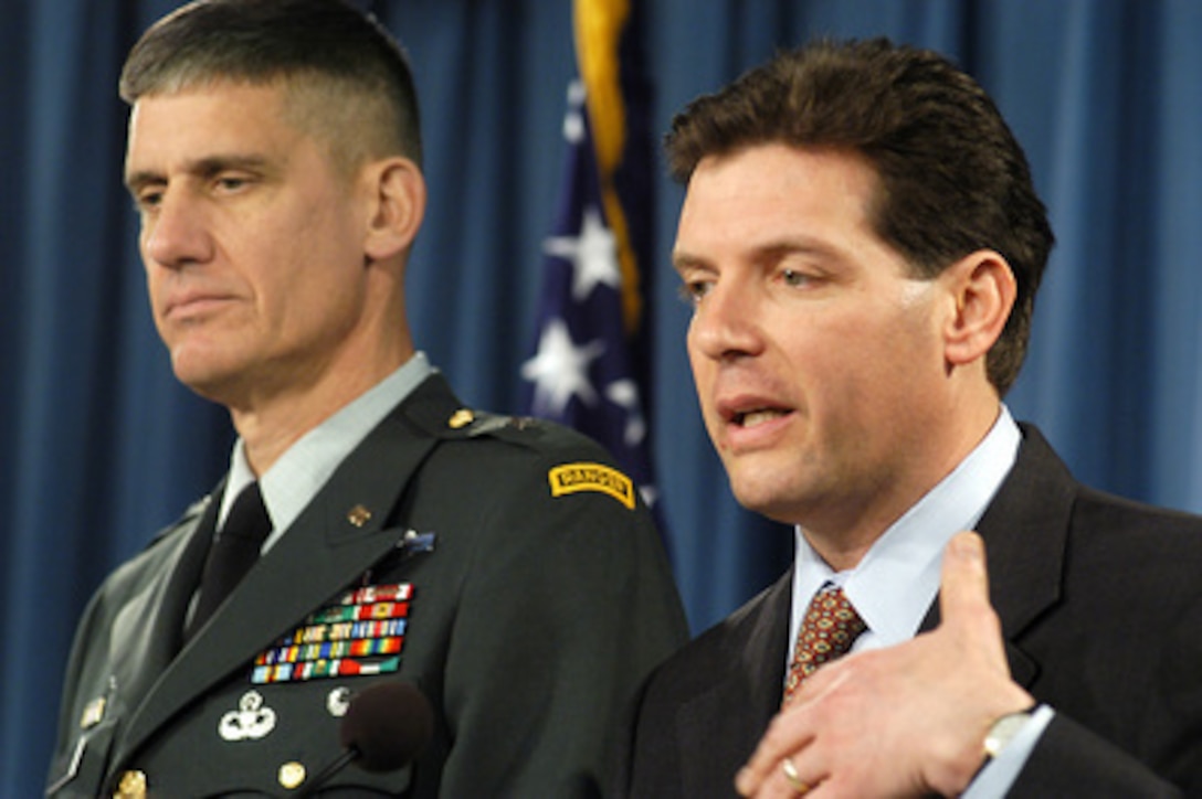 Principal Deputy Assistant Secretary of Defense for Public Affairs Lawrence Di Rita (right) responds to a reporter's question during an operational update briefing in the Pentagon on Feb. 22, 2005. Deputy Director for Regional Operations for the Joint Staff Brig. Gen. David Rodriguez, U.S. Army, (left) joined Di Rita in the briefing. 