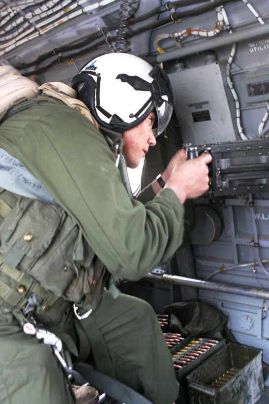 UDAIRI RANGE, Kuwait (Feb. 24, 2005) -- Lance Cpl. Ernesto Robles, 19, a flight equipment technician with Marine Medium Helicopter Squadron 165 (REIN), and a native of Los Angeles, fires a .50-caliber machine gun at his target during a live-fire exercise here. HMM-165 (REIN), attached to the 15th Marine Expeditionary Unit (Special Operations Capable), is training in Kuwait to maintain their skills as an Aviation Combat Element. (Official USMC photo by Lance Cpl. Thomas J. Grove)