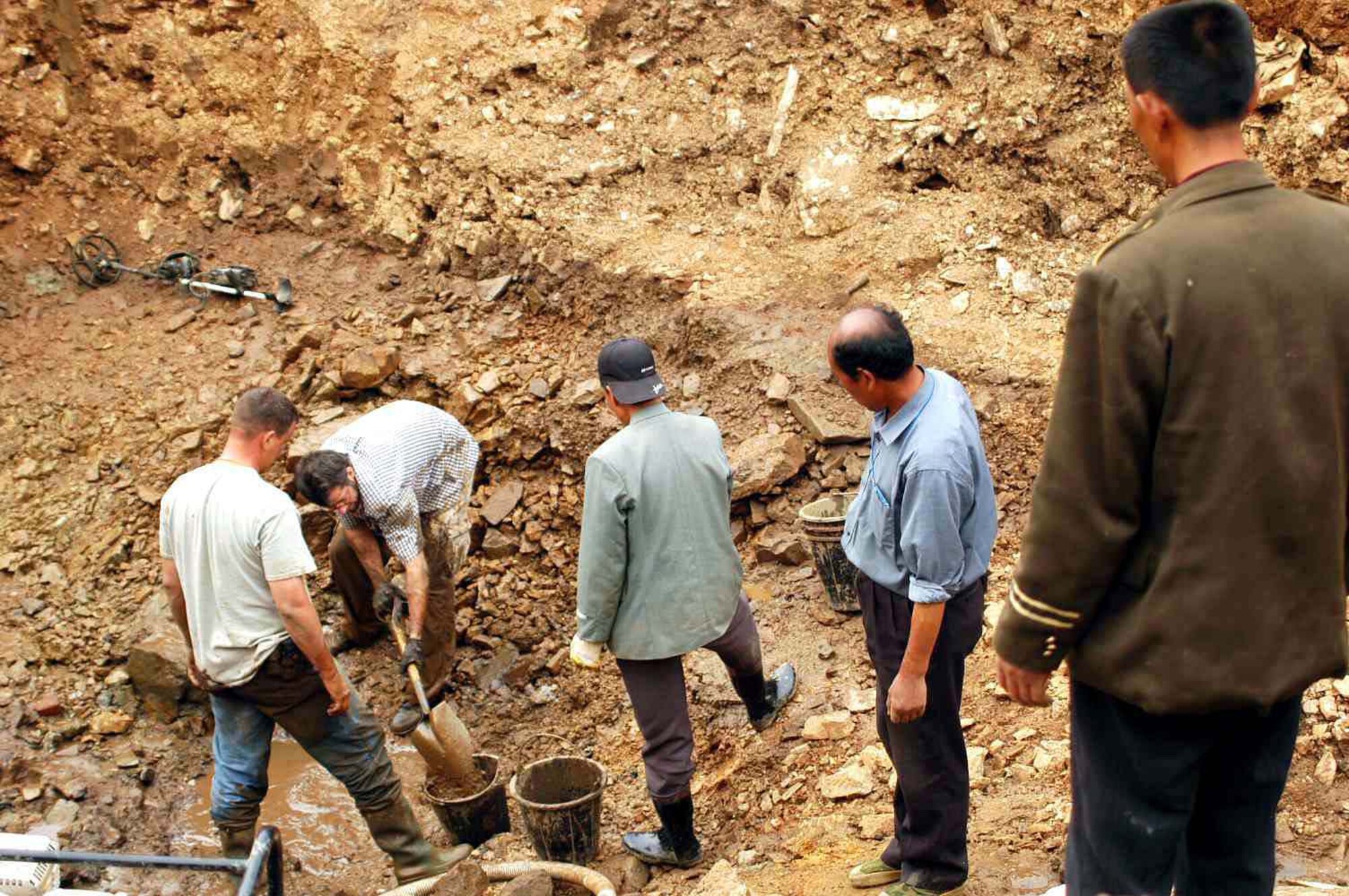 DANDONG, China -- A team from the Joint POW/MIA Accounting Command at Hickam Air Force Base, Hawaii, conducts a site excavation where Capt. Troy Cope's remains were recovered.  (Courtesy photo)