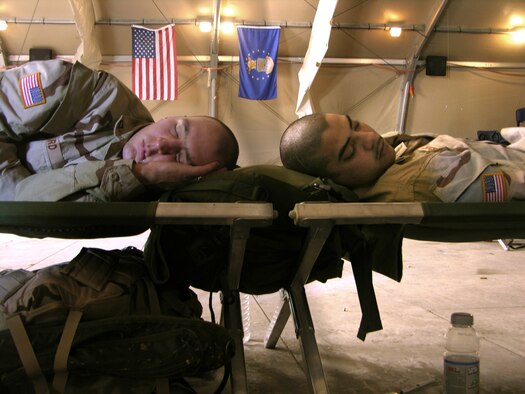 MANAS AIR BASE, Kyrgyzstan -- Soldiers catch up on sleep here Feb. 26.  More than 1,500 transient troops made their way through the base Feb 22 to 26, pushing the base to a 190 percent occupancy rate.  Officials with the 376th Expeditionary Services Squadron shut down the base fitness facility as well as various recreational areas to house the visitors.  (U.S. Air Force photo by Staff Sgt. J. Russell Martin)