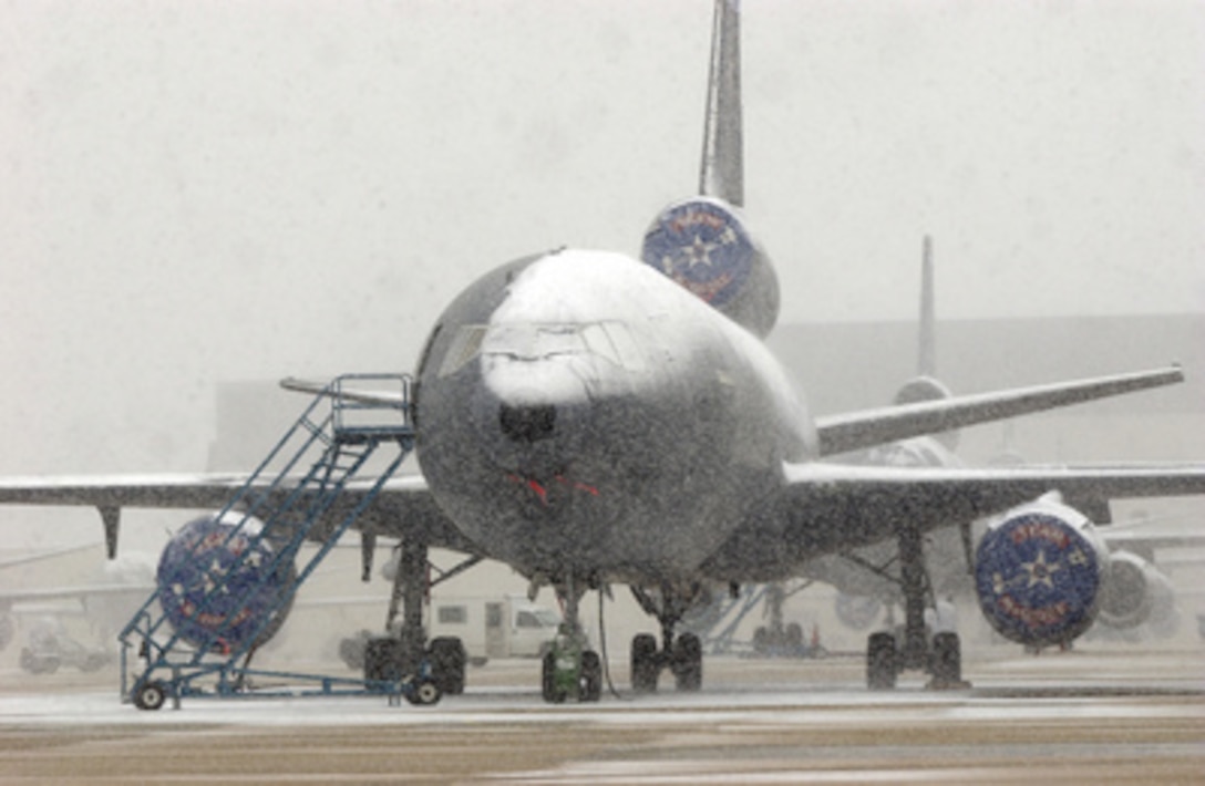 Snow coats the fuselage and wings of an Air Force KC-10A Extender as it sits on flight line at McGuire Air Force Base, N.J., during a snowstorm, on Feb. 24, 2005. The Extender is an advanced tanker and cargo aircraft with a primary mission of aerial refueling. 