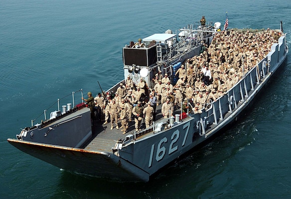 Persian Gulf (Feb. 28, 2005)  U.S. Marines and Sailors, assigned to the 31st Marine Expeditionary Unit (MEU), return to the amphibious assault ship USS Essex (LHD 2) aboard Landing Craft Utility 1627 (LCU 1627). The 31st MEU spent five months in Iraq conducting combat operations. Essex is forward deployed from Sasebo, Japan, and will be making the transit home once the 31st MEU backload is complete.