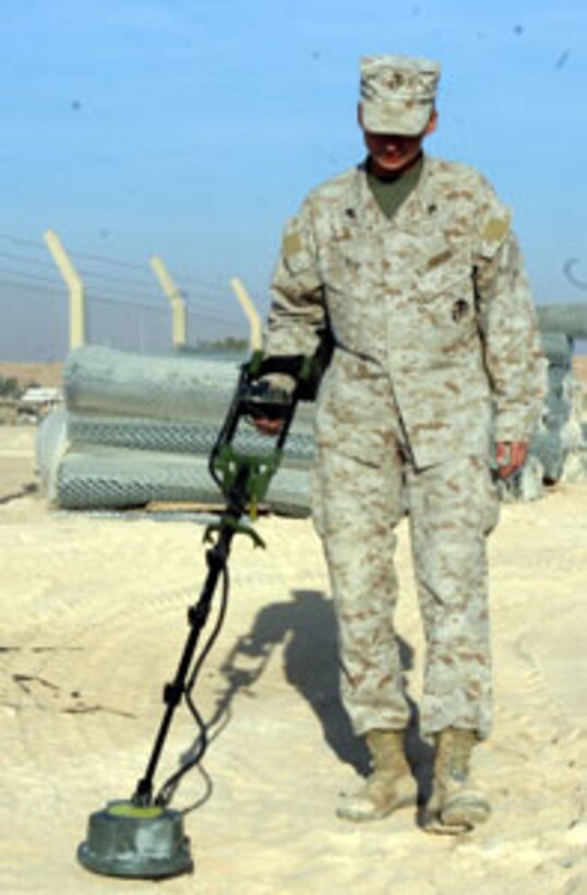 Corporal Marcella Hain, a Marine with Marine Wing Support Squadron 272?s mine clearing detachment, works to find artificial mines during a training exercise at Al Asad, Iraq.