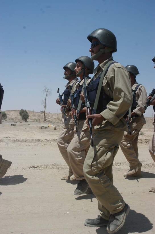 CAMP ALI Ar Ramadi, Iraq - Iraqi Security Forces march in formation during a training session here. Marines with the Combined Action Platoon, Company B, 1st Battalion, 5th Marine Regiment, are responsible for training new members of the Iraqi Security Forces during the infantry battalion's deployment in support of Operation Iraqi Freedom.   Photo by: Cpl. Tom Sloan