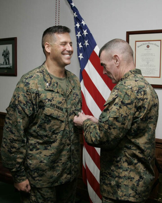 MARINE CORPS BASE CAMP LEJEUNE, N.C. - Lieutenant Colonel Terence P. Brennan, commanding officer for Headquarters Battalion, 2nd Marine Division, is presented the Bronze Star Medal here Nov. 1.  The 45-year-old Little Compton, R.I. native received the nation's fourth highest award for his superior leadership while commanding his former artillery unit, 2nd Battalion, 10th Marine Regiment, during a recent deployment to Iraq's turbulent Al Anbar province.