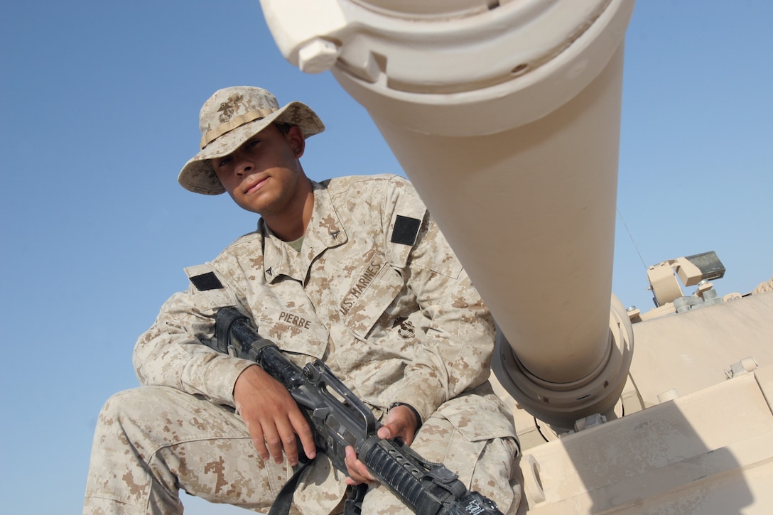 Lance Cpl. Josue Pierre, administrative clerk, Bravo Company, 2nd Tank Battalion, 2nd Marine Division, can be found working in the COC on most days, but when the battalion goes on missions outside the wire, he puts himself in the turret. Pierre said serving on deployment has been a unique experience, and feels honored to have assisted with security and stability efforts in Iraq.