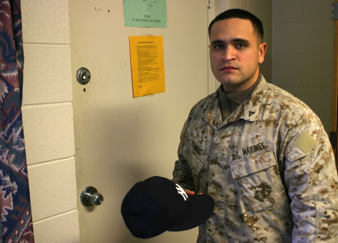 MARINE CORPS BASE CAMP LEJEUNE, N.C. (February 1, 2005) - Lance Cpl. Antonio G. Ramos, a fiscal clerk for 2d Marine Division comptroller, reflects on the glory days of high school baseball.    Now the Bronx, N.Y., native is responsible for managing funds used by the division for training and operations.  Official Marine Corps photo by Pfc. Terrell A. Turner released.