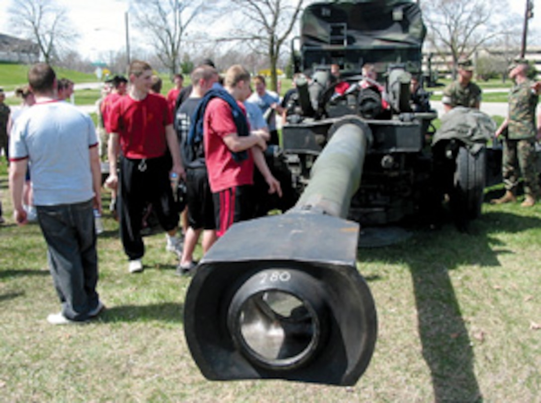 Poolees of RS Indianapolis enjoy a weapons display set up by I&I Joliet, Ill., at the RS' annual state-wide pool function at Grissom Air Reserve Base April 1 . (Official Marine Corps photo by Sgt. Jason D. Gallentine)