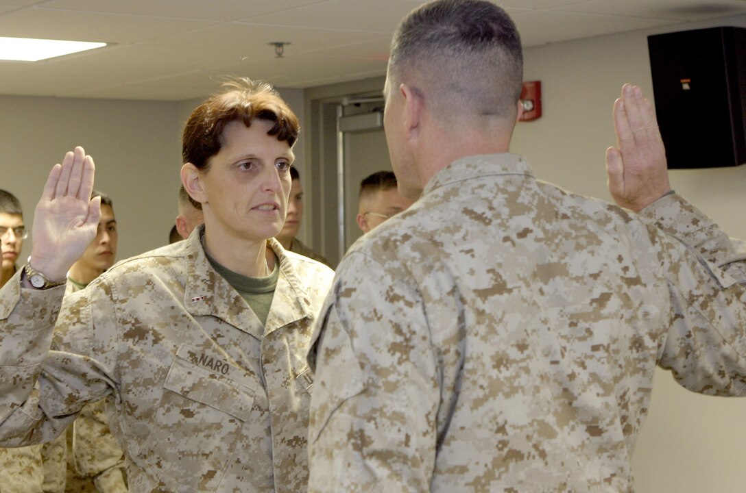 MARINE CORPS BASE CAMP LEJEUNE, N.C. (February 2, 2005) -- Chief Warrant Officer Toni M. Naro, personnel officer, 2nd Marine Division, recites the officer oath in front of Col. Robert L. Davis, commanding officer, Regimental Combat Team 2 during her promotion to chief warrant officer-5.  She has been in the personnel and administration field since she joined the Corps in 1981.