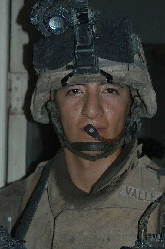 AR RAMADI Iraq (July 2, 2005)  --Lance Cpl. Manuel Valle Jr., a rifleman and team leader with 2nd Squad, 1st Platoon, Company A, 1st Battalion, 5th Marine Regiment, conducted a raid in the city here early July 2 and apprehended three insurgents. The 22-year-old from Parlier, Calif., chased down and tackled one of the insurgents after he tried to flee. Valle is on his third Iraq deployment in support of Operation Iraqi Freedom. Photo by: Cpl. Tom Sloan