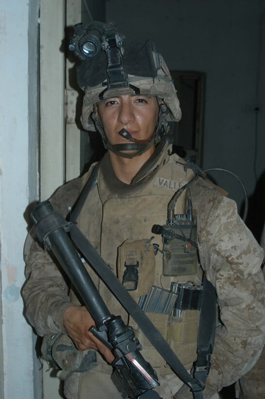 AR RAMADI Iraq (July 2, 2005)  --Lance Cpl. Manuel Valle Jr., a rifleman and team leader with 2nd Squad, 1st Platoon, Company A, 1st Battalion, 5th Marine Regiment, conducted a raid in the city here early July 2 and apprehended three insurgents. The 22-year-old from Parlier, Calif., chased down and tackled one of the insurgents after he tried to flee. Valle is on his third Iraq deployment in support of Operation Iraqi Freedom. Photo by: Cpl. Tom Sloan
