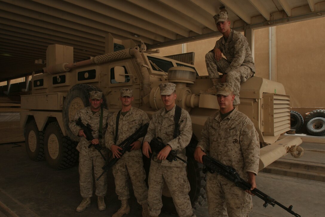 CAMP AL QA'IM, Iraq (July 23, 2005)- Lance Cpl. Lee D. Hale (top), 22, a combat engineer team leader with 3rd Squad, Company A, 4th Combat Engineers Battalion from Huntington, W.Va., is a corrections officer in his civilian life as a Marine reservist. The 2001 Huntington High School graduate will be meritoriously promoted to corporal in August for his work thus far in his deployment. Sgt. Brandon Bowling (far left), 32, is Hale's squad leader. (From left to right) Lance Cpls. Justin L. Shivley, 20, a driver, Jacob Towner, 22, a squad automatic weapon gunner and Seth A. Montgomery, 21 are in Hale's fire team. (Official U.S. Marine Corps photo by Lance Cpl. Lucian Friel (RELEASED)
