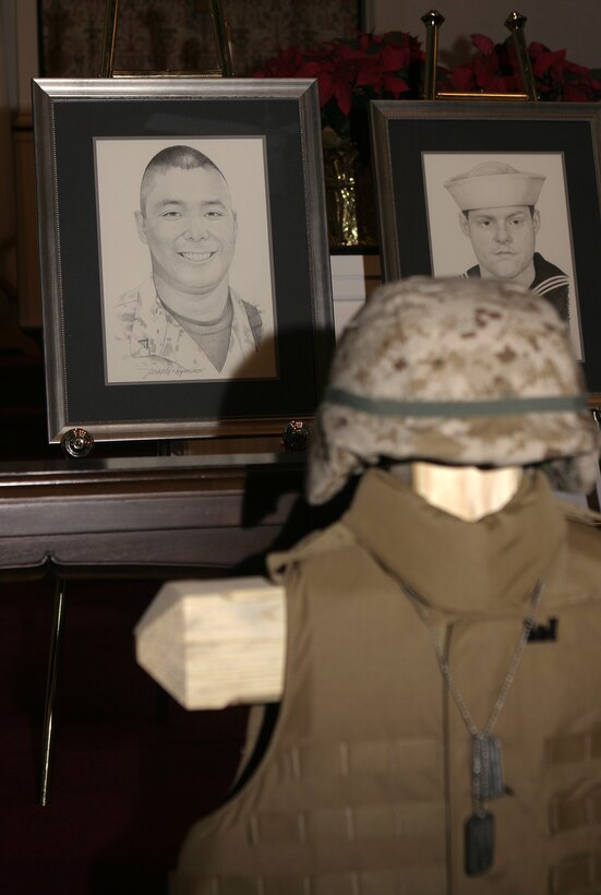MARINE CORPS BASE CAMP LEJEUNE, N.C. - A black-and-white sketch of Lance Cpl. Mario Castillo, an engineer with 2nd Combat Engineer Battalion, rests behind his gear display during a memorial service here Dec. 2.  First Battalion, Sixth Marine Regiment and 2nd CEB personnel had gathered at the Main Protestant Chapel here to commemorate the lives of Castillo, Lance Cpl. Andrew Kilpela, Lance Cpl. Joshua Klinger and 'Doc' Aaron Kent.  The four service members were killed by improvised explosive devices during the unit's deployment to Iraq from March through October.