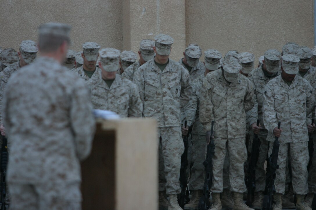 CAMP AL QA'IM, Iraq (March 22, 2005)- The Marines of 3rd Battalion, 2nd Marine Regiment honor their fallen brother Lance Cpl. Kevin Smith who was killed in action by a vehicle borne improvised explosive device March 21. The Memorial ceremony took place here March 22. The Battalion Chaplain Lt. John Anderson gives a memorial speech in honor of Smith, who was with the battalion's security platoon. Official U.S. Marine Corps photo by Lance Cpl. Lucian Friel (RELEASED)