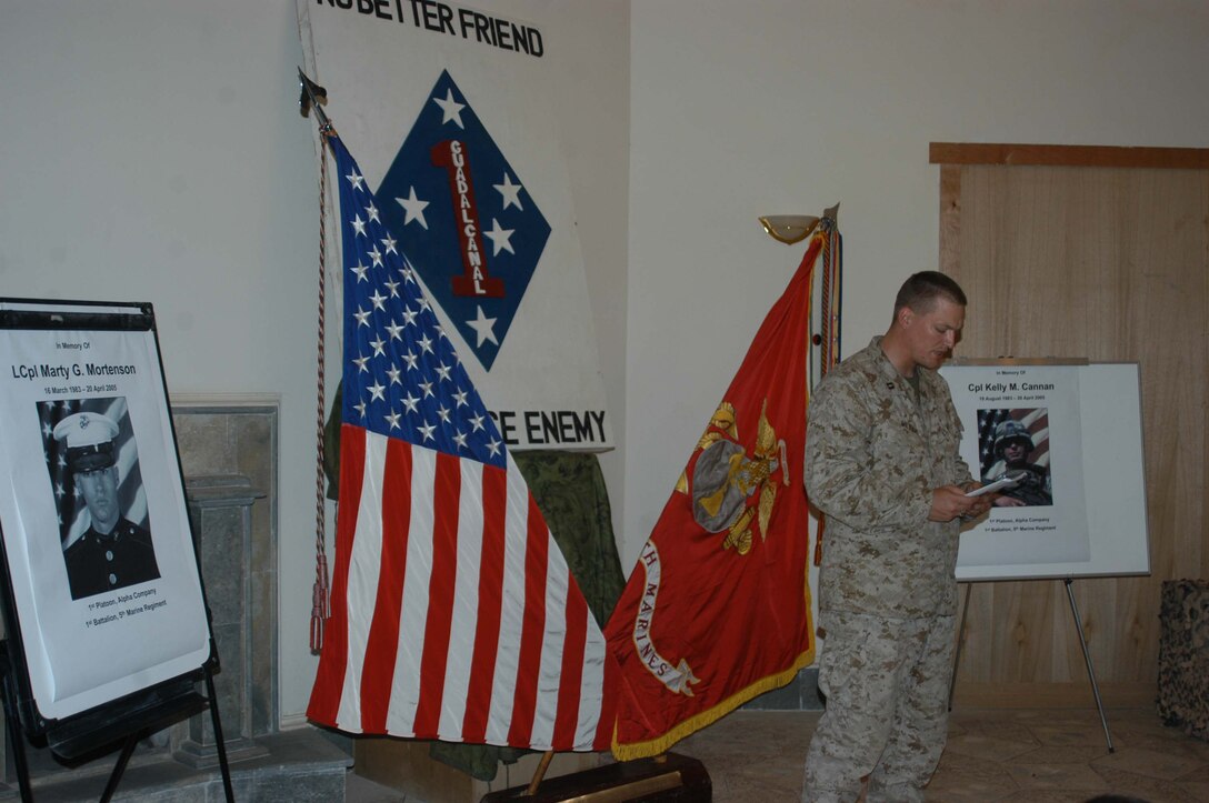 CAMP HURRICANE POINT, Ar Ramadi, Iraq (April 25, 2005) - Navy Lt. Aaron T. Miller, chaplain, 1st Battalion, 5th Marine Regiment, delivers the invocation during a memorial ceremony here. Marines with 1st Battalion, 5th Marine Regiment, held a dual memorial ceremony in honor of Lance Cpl. Marty G. Mortenson, 22, of Flagstaff, Ariz., and Cpl. Kelly M. Cannan, 21, of Lowville, N.Y. Both warriors were killed by the same improvised explosive device attack while traveling in a convoy April 20. They were on their third deployment supporting Operation Iraqi Freedom. Photo by Cpl. Tom Sloan