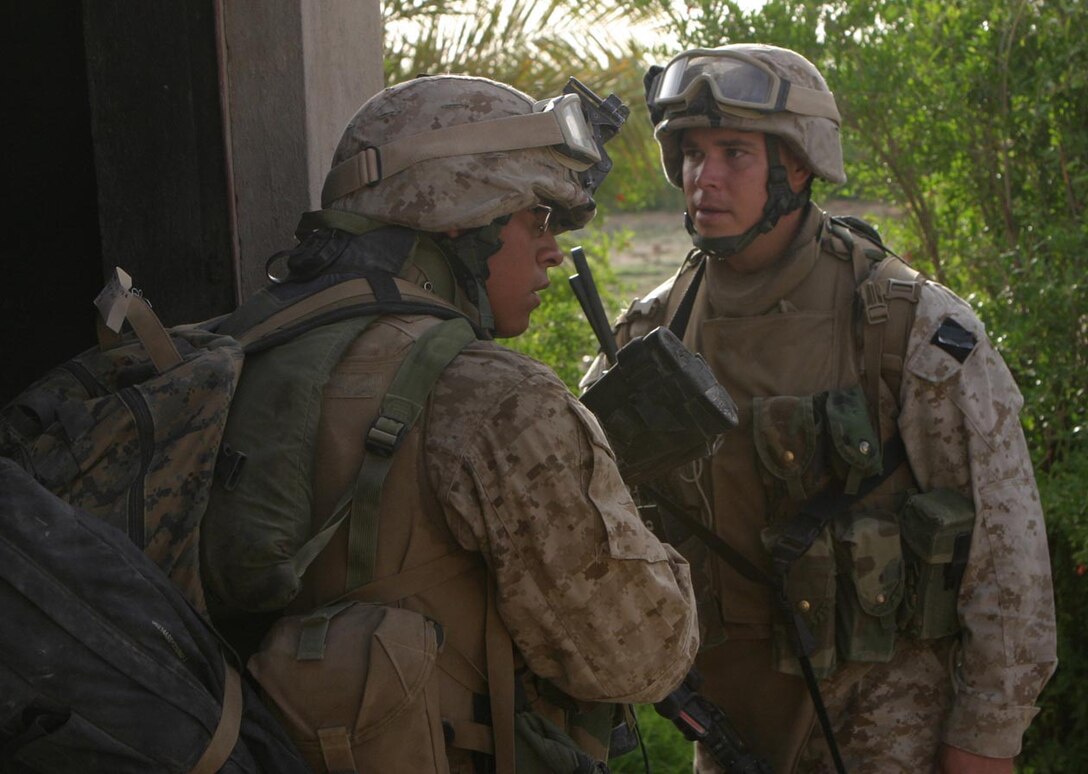 CAMP DELTA, IRAQ -- Standing in the doorway of an Iraqi home, Sgt. Greg Zieba watches as one of his fireteams searched one of the local homes in the city of Al Karmah during Operation Clear Decision.  Official U.S. Marine Corps photo by Lance Cpl. Athanasios L. Genos