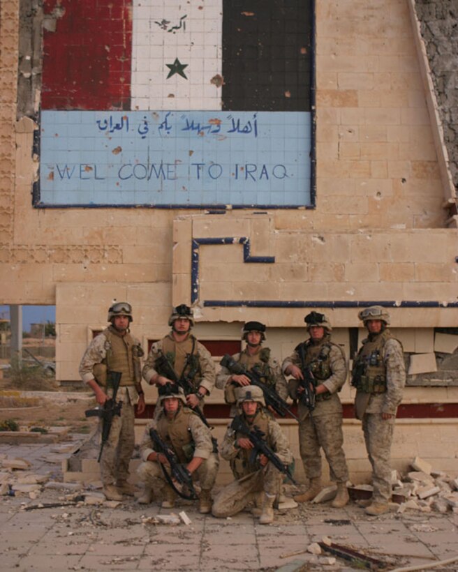 HUSAYBAH, Iraq (May 3, 2005)-(Front to back, left to right) Lance Cpls. Charles Young, 19, from Oldsmar, Fla., Joshua Butler, 20, a native of Altoona, Pa., 1st Sgt. Donald Brazeal, 40, of Council Bluffs, Iowa, Cpl. Roy Mitros, 22, from Huntsville, Ala., Cpl. Anthony Fink, 21, of Columbus, Ohio, Sgt. Paul Mathis, 23, Churchville, Pa., and Hospital Corpsman 2nd Class Jessie Beddia, 31, from Buytown, Texas were all key players in stopping the insurgent attacks here April 11. All these leathernecks are with India Company, 3rd Battalion, 2nd Marine Regiment, Regimental Combat Team-2. Official U.S. Marine Corps photo by Lance Cpl. Lucian Friel (RELEASED)