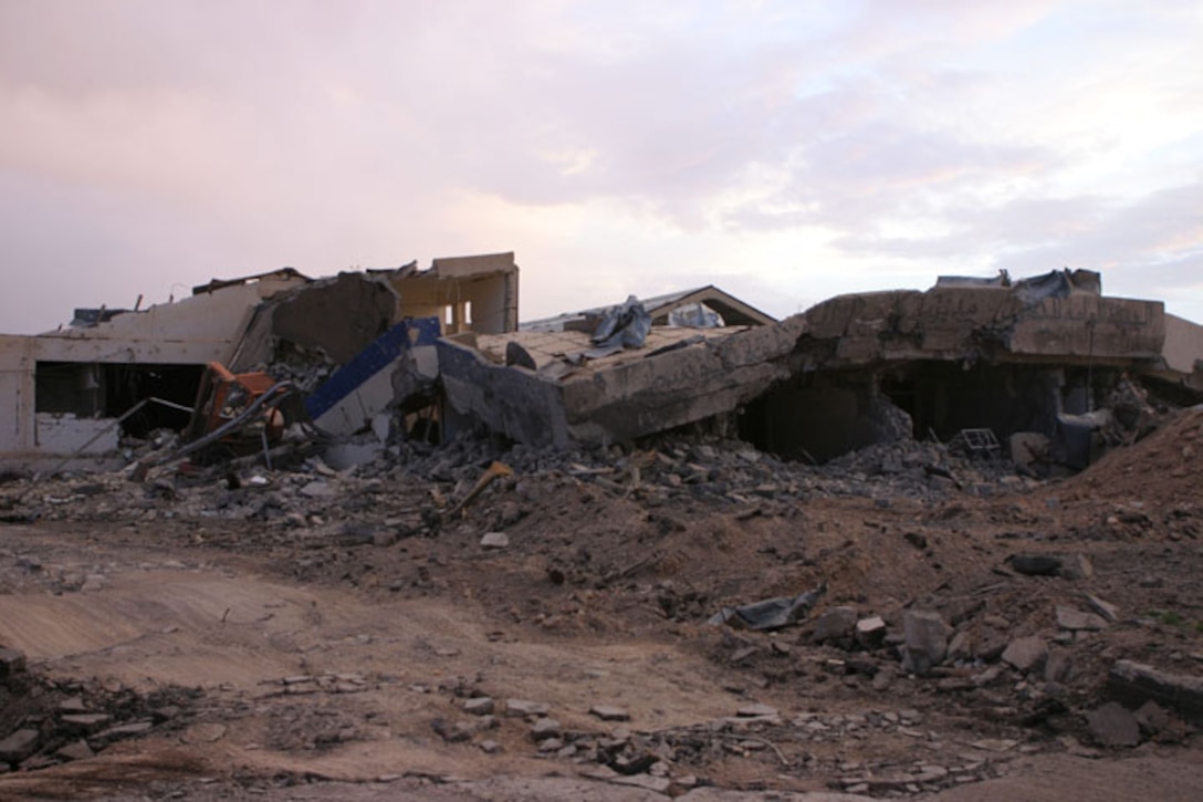 HUSAYBAH, Iraq (May 3, 2005)- This building was completely destroyed during attacks on Camp Gannon April 11 when two large trucks tried to breach the defensive perimeter of the camp. Lance Cpl. Joshua Butler, a rifleman with India Company, 3rd Battalion, 2nd Marine Regiment, Regimental Combat Team-2 was instrumental in the defense of the camp. Official U.S. Marine Corps photo by Lance Cpl. Lucian Friel (RELEASED)