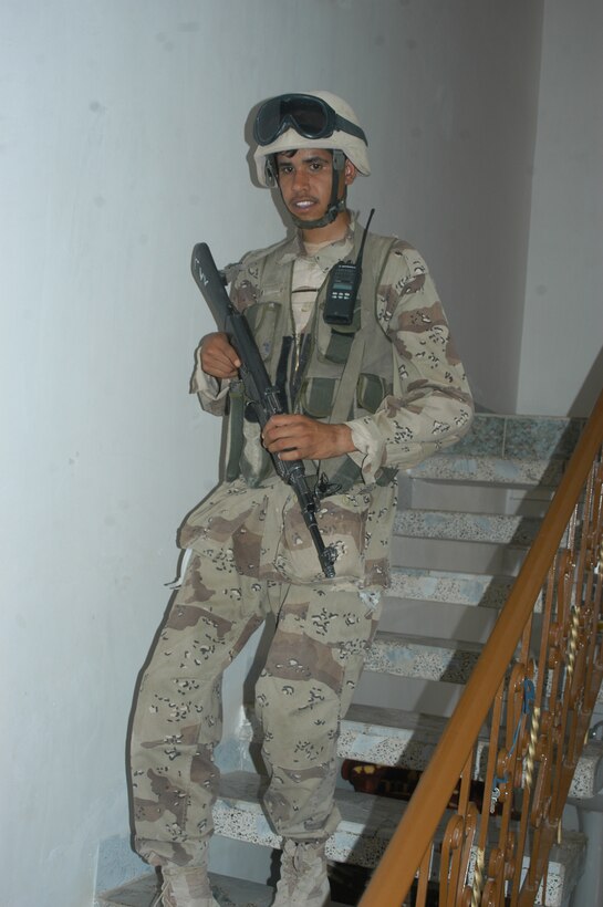 AR RAMADI Iraq (June 3, 2005) - An Iraqi Security Force member walks down a flight of stars in a house here during a mission. Seven members of the ISF accompanied Marines with 1st Squad, 2nd Platoon, Company C, 1st Battalion, 5th Marine Regiment, and, together, conducted a mission to listen to messages a mosque was broadcasting over its loudspeakers during midday prayer. Marines with Company C are having a positive influence on the locals in their area of operations by working with the ISF. Photo by: Cpl. Tom Sloan