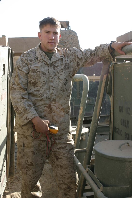 CAMP BLUE DIAMOND, RAMADI, Iraq -  Corporal Jeffery R. Lyskawa a refrigeration repair technician with Communications Company, Headquarter Battalion, 2nd Marine Division stands among a long row of military air conditioners.  Lyskawa maintains and repairs dozens of air conditioners and generators that keep the Division's Communications Company up and running. Lyskawa has taken on the role of a pseudo "Maytag Man" for Communications Company which provides the main conduit for all internet, phone and radio communications flowing into and out of Camp Blue Diamond which houses the 2nd Marine Division's Headquarters. Official U.S. Marine Corps photo by Sgt. Ryan S. Scranton