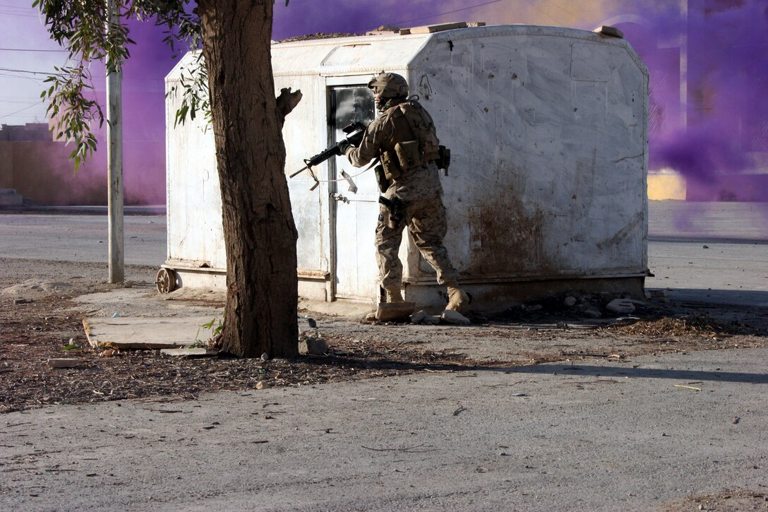 AR RAMADI, Iraq (December 3, 2005) - A Marine with Company L, 3rd Battalion, 7th Marine Regiment, stands guard during Operation Shank Dec. 3. Photo by Cpl. Shane Suzuki