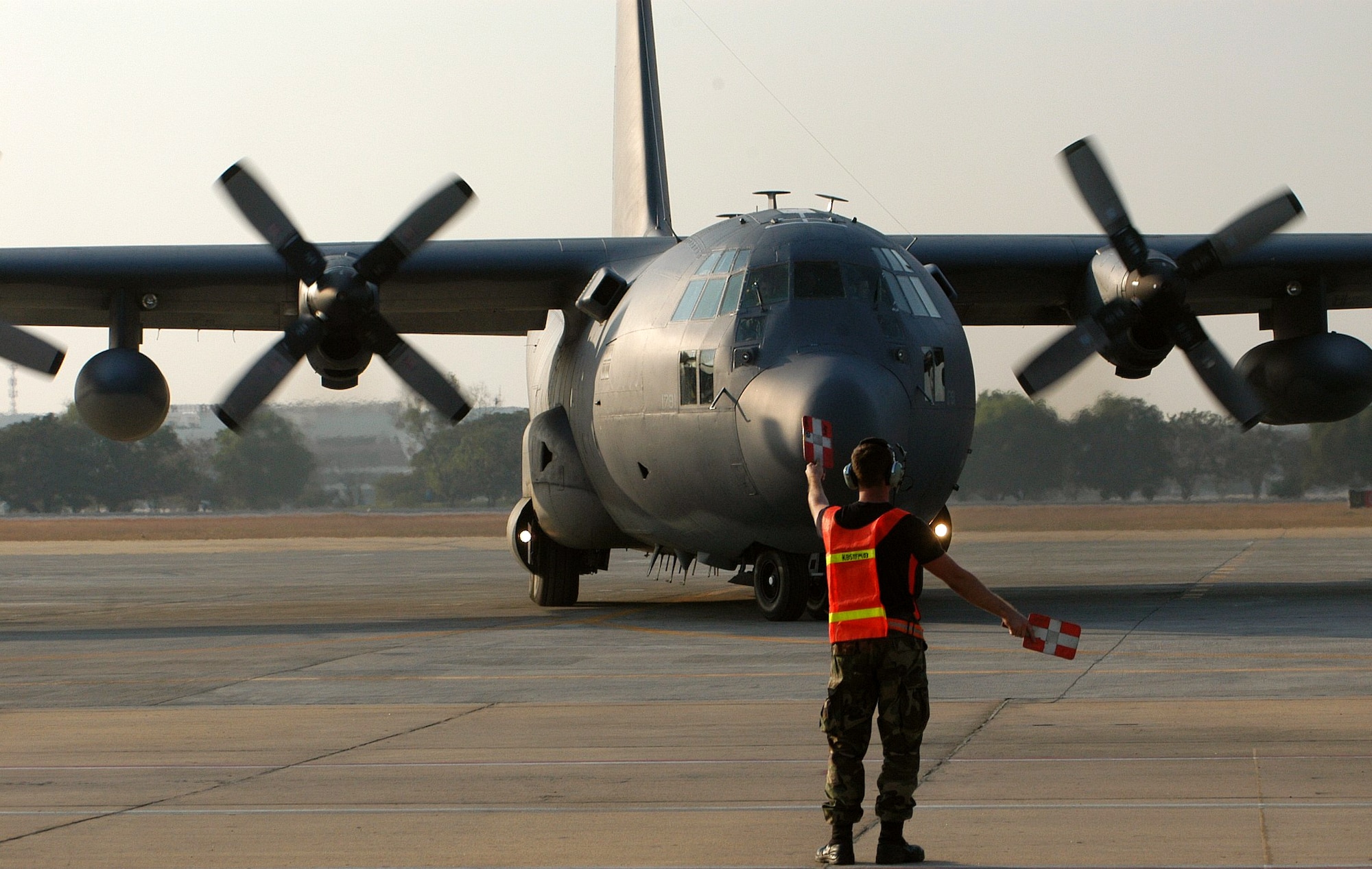 BANGKOK, Thailand -- An Airman here launches an MC-130 to Phuket, Thailand, on Jan. 1.  The plane was loaded with five pallets of blankets and medical supplies.  He and 100 others from the 353rd Special Operations Group are flying supplies to the tsunami-hit areas of southern Thailand. The 353rd SOG is assigned to Kadena Air Base, Japan. (U.S. Air Force photo by Master Sgt. Michael Farris) 