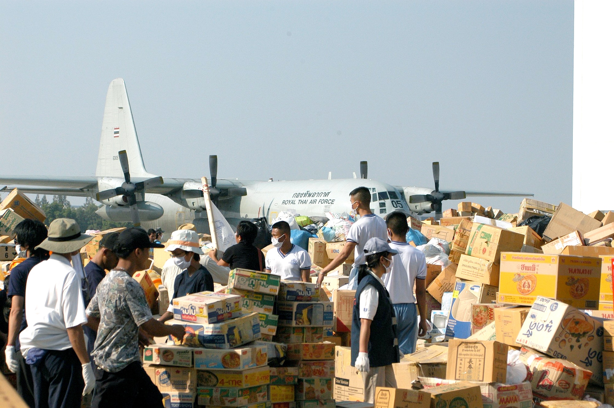 BANGKOK, Thailand -- Volunteers organize a sea of relief supplies between two hangars at the international airport here Jan. 1. (U.S. Air Force photo by Master Sgt. Michael Farris)