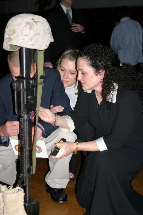 050304-M-2607O-003 MARINE CORPS BASE CAMP LEJEUNE, N.C. (March 4, 2005) – Kathleen Faircloth and her family morn the loss of her son Lance Cpl. Bradley M. Faircloth during the 1st Battalion, 8th Marine Regiment, memorial service for their fallen Marines at the Goettege Memorial Field House March 4.  Twenty- one Marines from the battalion paid the ultimate price to keep our county safe.