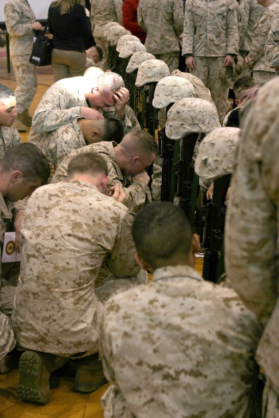 050304-M-2607O-004 MARINE CORPS BASE CAMP LEJEUNE, N.C. (March 4, 2005) – Friends of the 21 fallen Marines say their final goodbyes following the 1st Battalion, 8th Marine Regiment, memorial service at Goettege Memorial Field House March 4.  These Marines paid the ultimate price to keep our country safe.