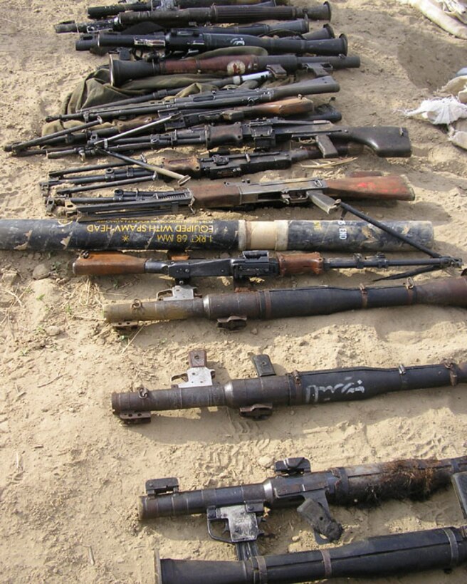 AL QA'IM, Iraq (June 4, 2005)- This is the weapons cache that Cpl. Christopher N. Blount, 22, a combat engineer with Company A, 4th Combat Engineer Battalion, Regimental Combat Team-2 found during Operation River Round-up. Blount is a native of Charleston, W.Va., and a 2001 Fairhaven Christian Hgh School graduate. Official U.S. Marine Corps photo by Lance Cpl. Lucian Friel (RELEASED)