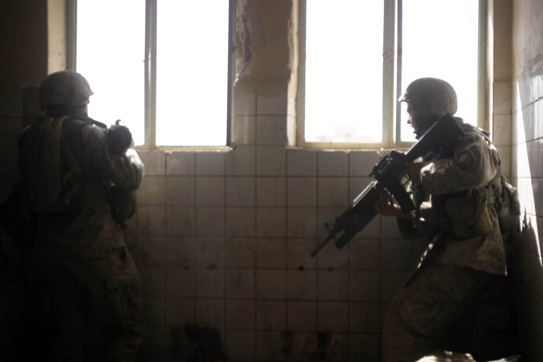 Hit, Iraq (September 4, 2005)-- Marines from Company "I", 3rd Battalion, 25th Marines respond to an attack by insurgents who disrupted civilians receiving money from multinational forces damaged a bridge, caused more than 40 WIAs, one KIA for multinational forces and eight civilian casualties. (Official USMC Photo by Corporal Ken Melton)