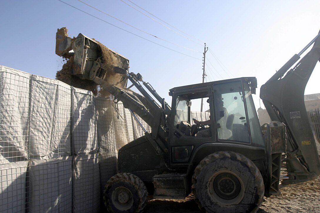 Hit, Iraq (September 5, 2005)-- Marines with 4th CEB repair damage from an attack by insurgents  on Company "I", 3rd Battalion, 25th Marines FOB.  (Official USMC Photo by Corporal Ken Melton)