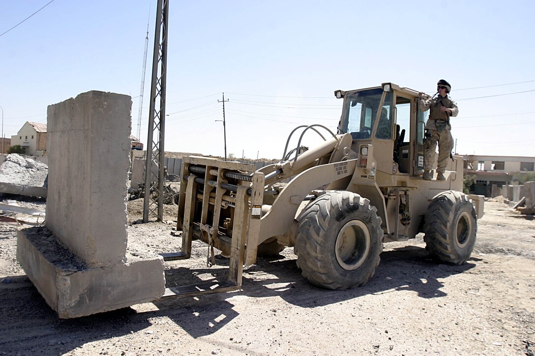 Hit, Iraq (September 8, 2005)-- Marines with 4th CEB repair damage from an attack by insurgents on Company "I", 3rd Battalion, 25th Marines FOB.  (Official USMC Photo by Corporal Ken Melton)