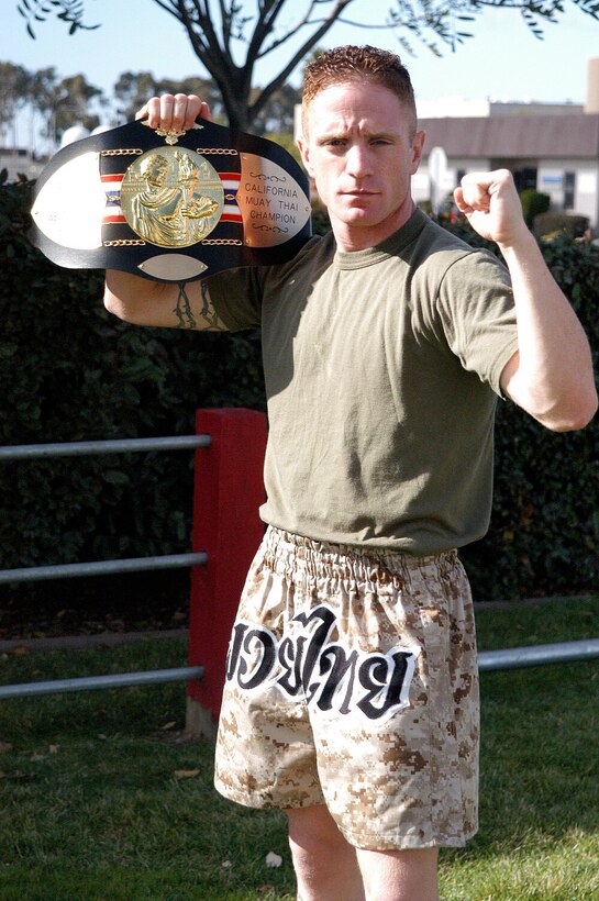 Reserve Sgt. Joe Sarkissian, Supply Administrator, MAG-46 poses with his International Karate Kickboxing California State Welter Weight Championship belt.