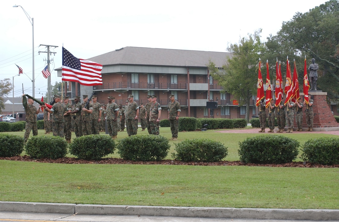 MARINE CORPS BASE CAMP LEJEUNE, N.C. (Oct. 4, 2005) - Major Gen. Robert C. Dickerson, newly appointed commander of Marine Corps Installations East, and Sgt. Maj. Charles E. Tucker, MCI-East sergeant major, uncase the official MCI-East organizational colors during a ceremony here today. (Official U. S. Marine Corps photo by Lance Cpl. Adam Johnston)