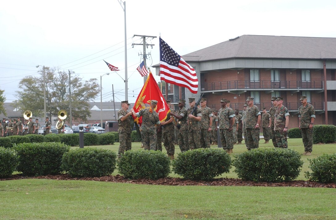 MARINE CORPS BASE CAMP LEJEUNE, N.C. (Oct. 4, 2005) - Major Gen. Robert C. Dickerson, newly appointed commander of Marine Corps Installations East, and Sgt. Maj. Charles E. Tucker, MCI-East sergeant major, uncase the official MCI-East organizational colors during a ceremony here today. (Official U. S. Marine Corps photo by Lance Cpl. Adam Johnston)