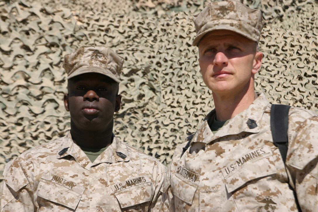 Sgt. Maj. William Burton, sergeant major, Marine All-Weather Fighter Attack Squadron 224, poses with fellow sergeant major, Sgt. Maj. Michael J. Closterman, sergeant major, Marine Wing Headquarters Squadron 2, March 5. Closterman was Burton?s drill instructor 21 years ago and now they are both serving in Al Asad, Iraq.