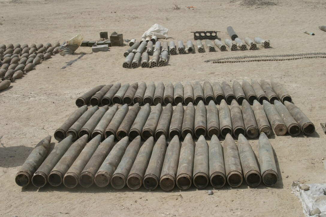 NORTHERN SECURITY ZONE, Iraq (June 05, 2005) - While conducting cache sweeps Marines from 2nd Assualt Amphibian Battalion, Company B, 1st Platoon, and soldiers from Engineer Battalion, Company C, 224, unearth several large weapon caches containing various weapons, bombs and IED making material.  The Marines and Soldiers attached to 2nd Marine Division, conducts counter-insurgency operations with Iraqi Security Forces to isolate and neutralize Anti-Iraqi Forces.  (Official Marine Corps photo by Sergeant Paul Mancuso)