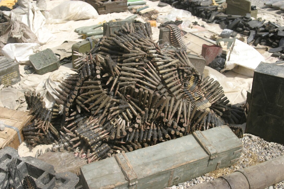 NORTHERN SECURITY ZONE, Iraq (June 05, 2005) - While conducting cache sweeps Marines from 2nd Assualt Amphibian Battalion, Company B, 1st Platoon, and soldiers from Engineer Battalion, Company C, 224, unearth several large weapon caches containing various weapons, bombs and IED making material.  The Marines and Soldiers attached to 2nd Marine Division, conducts counter-insurgency operations with Iraqi Security Forces to isolate and neutralize Anti-Iraqi Forces.  (Official Marine Corps photo by Sergeant Paul Mancuso)