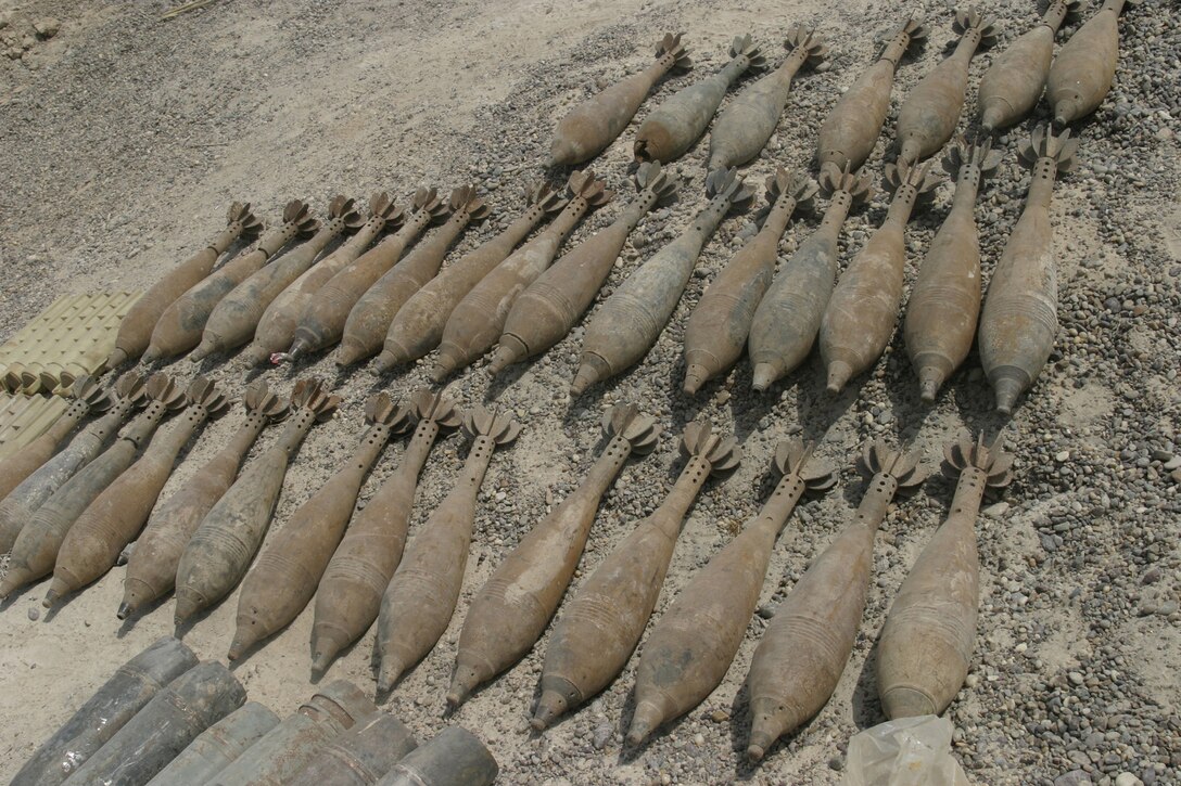 NORTHERN SECURITY ZONE, Iraq (June 05, 2005) - While conducting cache sweeps Marines from 2nd Assualt Amphibian Battalion, Company B, 1st Platoon, and soldiers from Engineer Battalion, Company C, 224, unearth several large weapon caches containing various weapons, bombs and IED making material.  The Marines and Soldiers attached to 2nd Marine Division, conducts counter-insurgency operations with Iraqi Security Forces to isolate and neutralize Anti-Iraqi Forces.  (Official Marine Corps photo by Sergeant Paul Mancuso)
