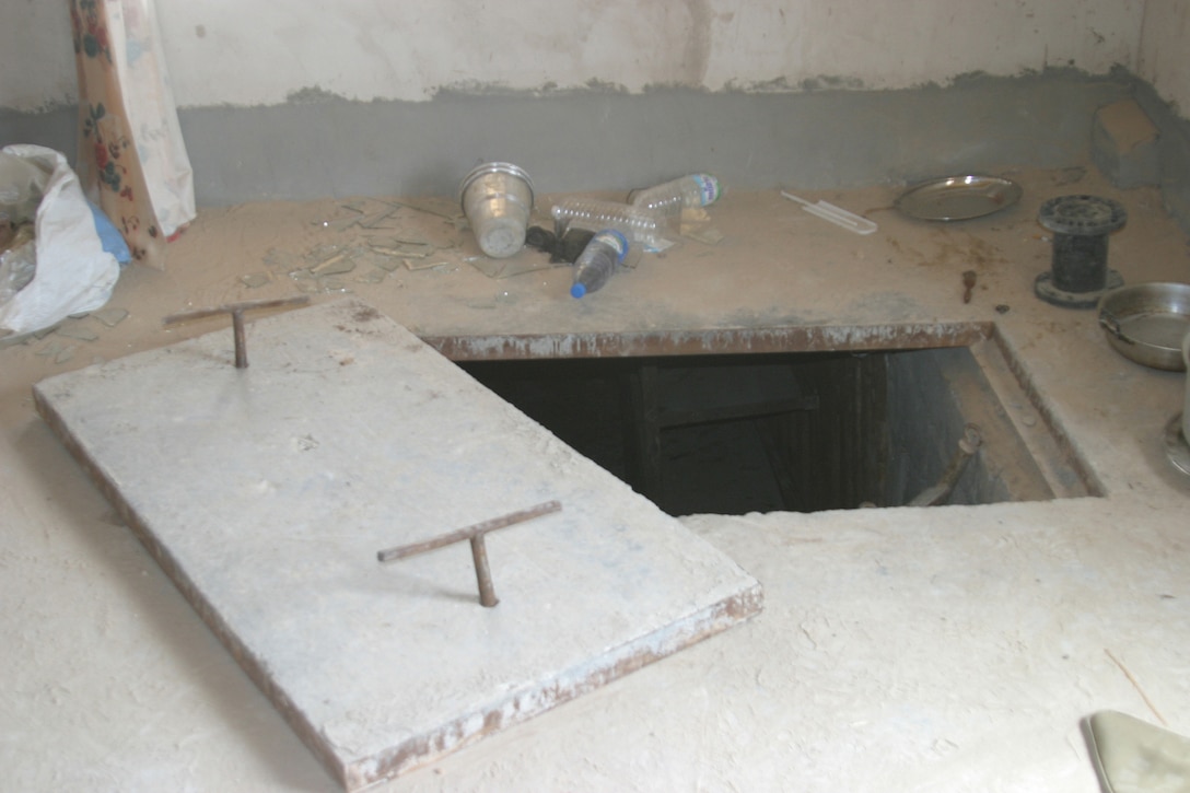 NORTHERN SECURITY ZONE, Iraq (June 05, 2005) -  The entrance to an underground bunkers was found while conducting cache sweeps. The Marines and Soldiers attached to 2nd Marine Division, conducts counter-insurgency operations with Iraqi Security Forces to isolate and neutralize Anti-Iraqi Forces.  (Official Marine Corps photo by Sergeant Paul Mancuso)