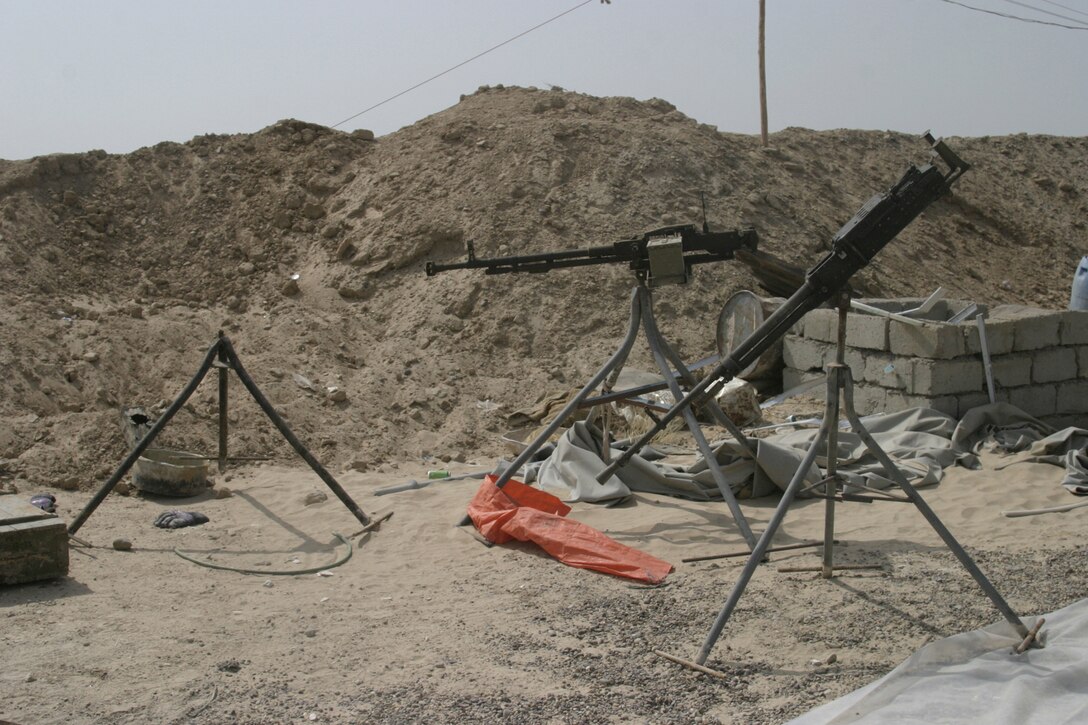 NORTHERN SECURITY ZONE, IRAQ (June 05, 2005) - Machineguns such as these were found by Marines from 2nd Assault Amphibian Battalion, Company B, 1st Platoon, and soldiers from Engineer Battalion, Company C, 224, when they unearth several large weapon caches.  The Marines and Soldiers attached to 2nd Marine Division, conducts counter-insurgency operations with Iraqi Security Forces to isolate and neutralize Anti-Iraqi Forces.