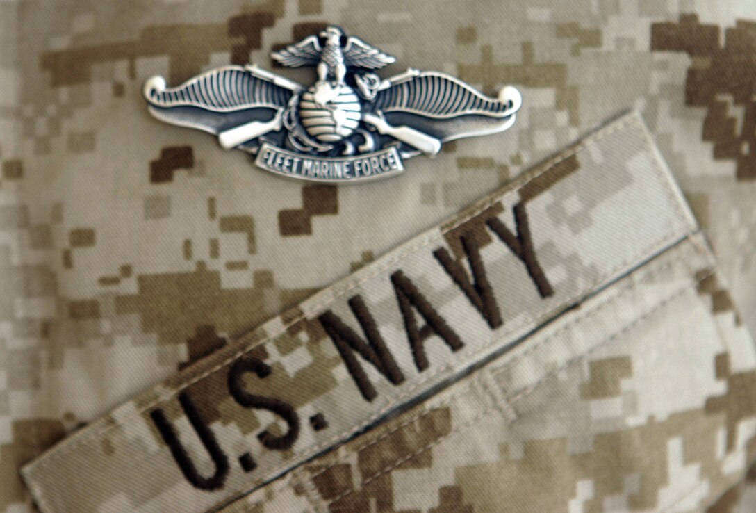 CAMP BAHARIA, Iraq - A Fleet Marine Force Warfare pin is displayed on a corpsman's chest here July 5.  Four 1st Battalion, 6th Marine Regiment 'docs' were recognized for their mastery of Marine concepts, ranging from military history, to weapons employment, to infantry tactics.