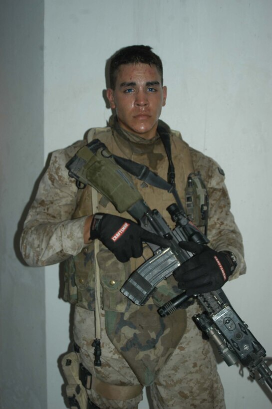 AR RAMADI Iraq (July 22, 2005) - Corporal Kelly P. Baker, a rifleman and team leader with 2nd Squad, 1st Platoon, Company C, 1st Battalion, 5th Marine Regiment, is a third generation American Indian serving in the Marine Corps during a time of conflict. The 21-year-old from New Town - a city inside Ft. Berthold Indian Reservation in North Dakota - is descendant of affiliated Great Plains tribes Mandan, Hidasta and Arikara. His grandfather, Clyde Baker, served during World War II and fought in the Battle of Okinawa. His father Hugh served during Vietnam. Both left the Corps as corporals.